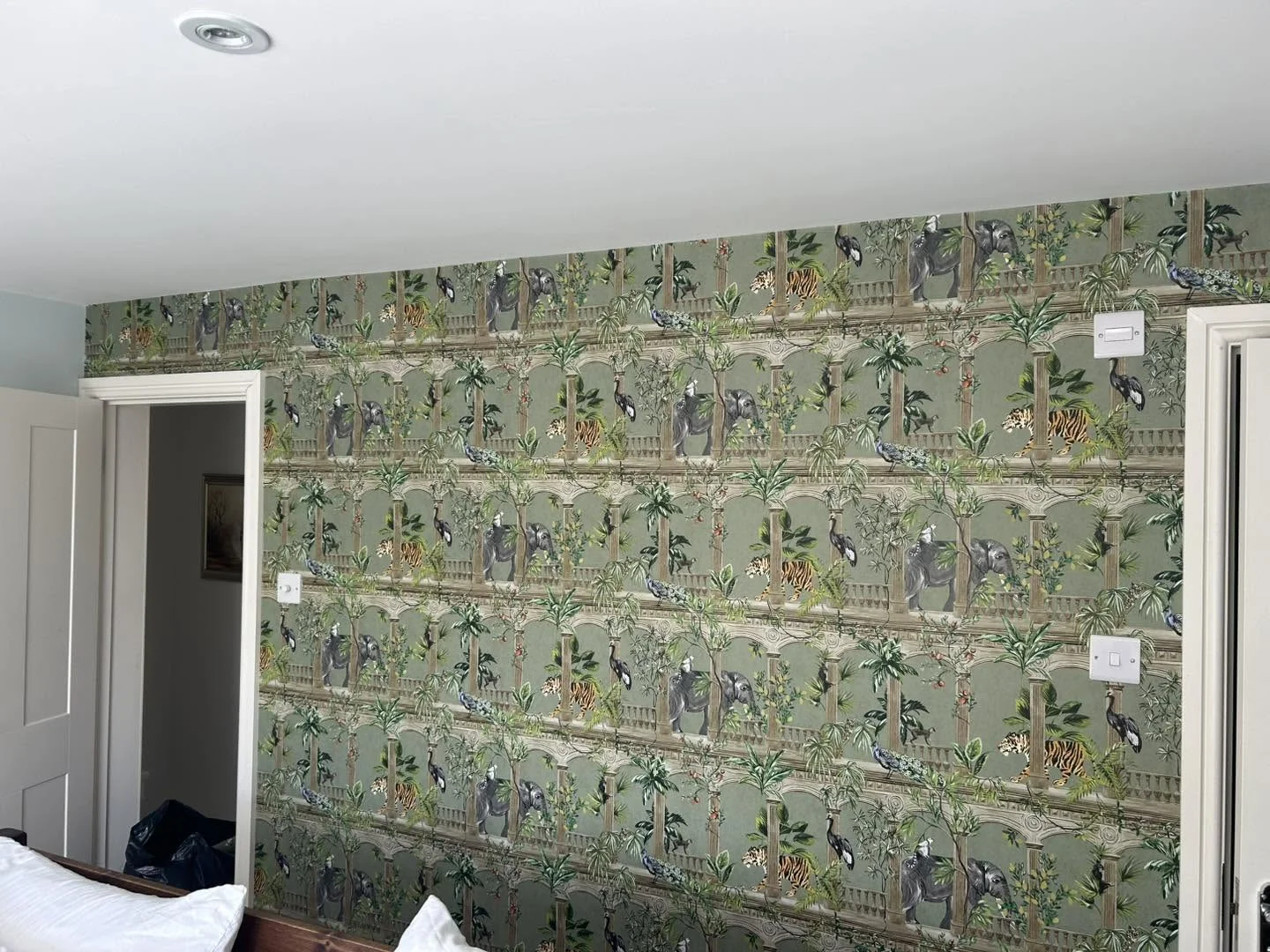 Wallpapering - chinoiserie feature wallpaper in bedroom by Dean Ongley
