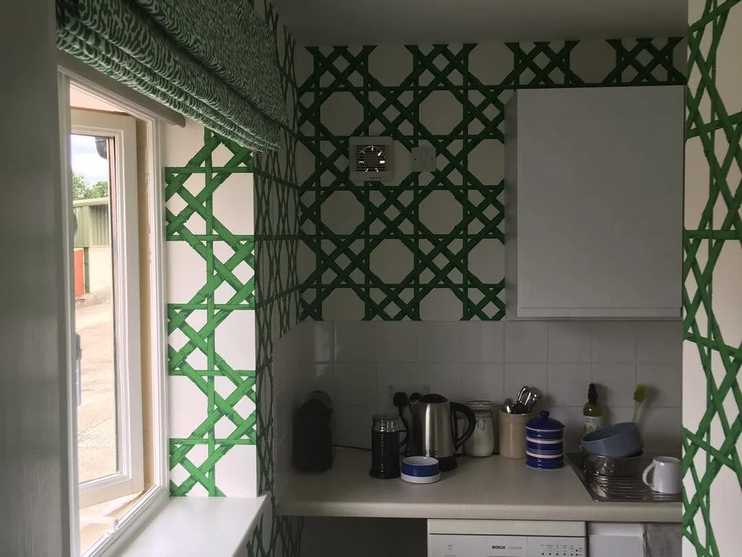 Green lattice wallpaper in kitchen