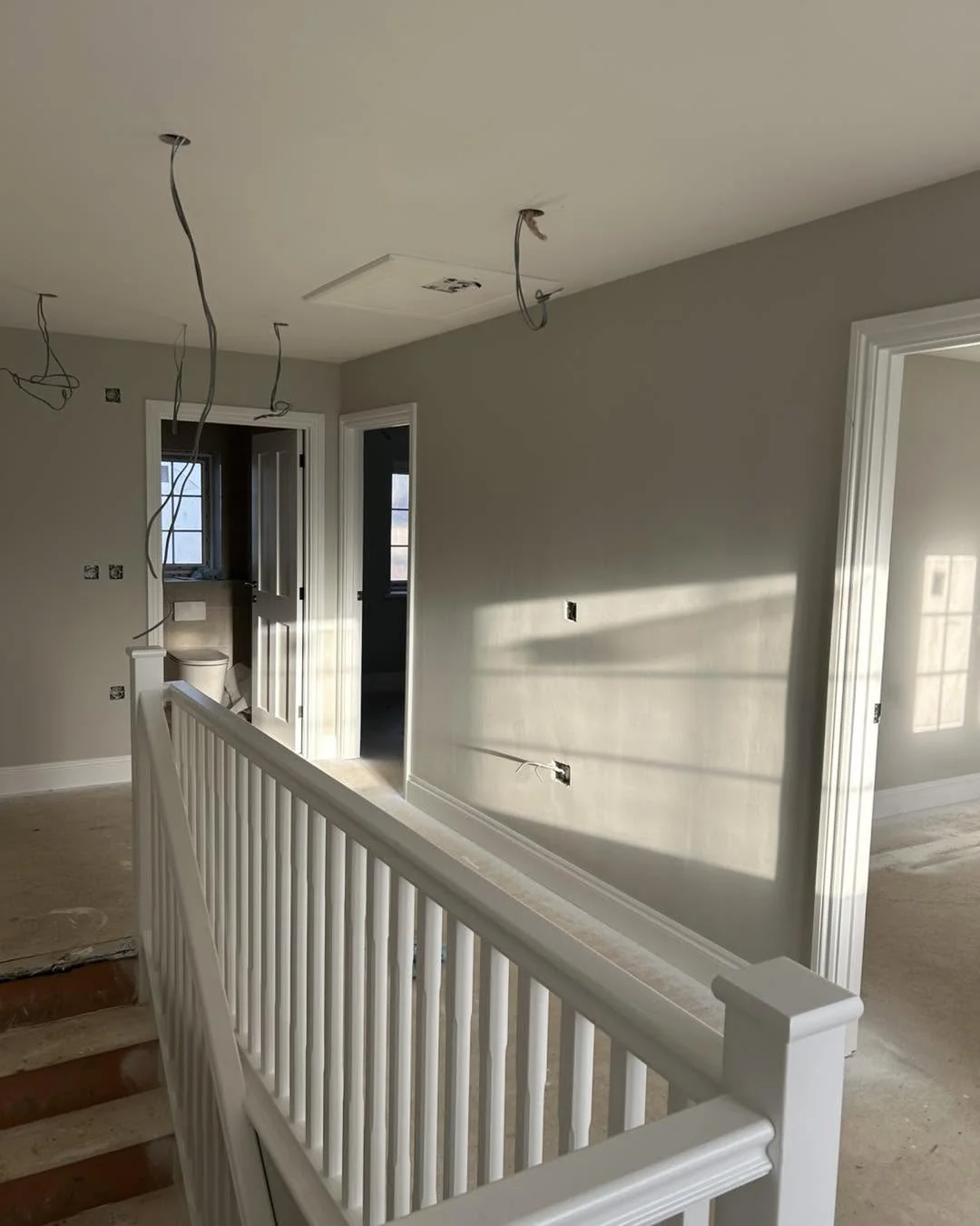 New build landing grey walls white balustrade