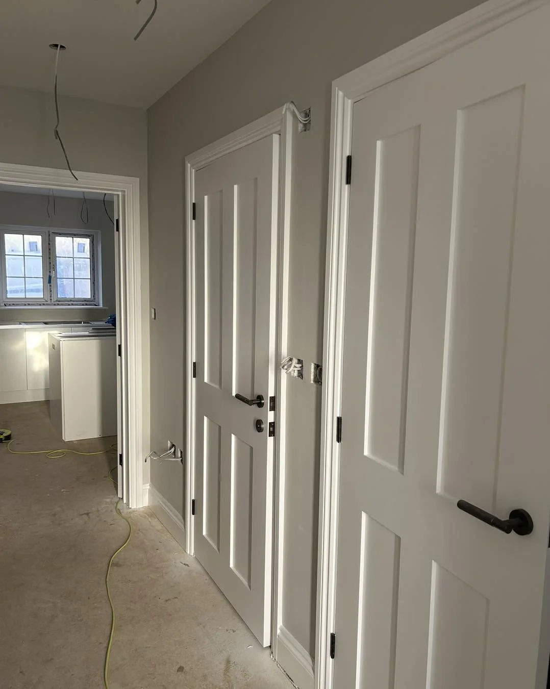 New build hallway white doors